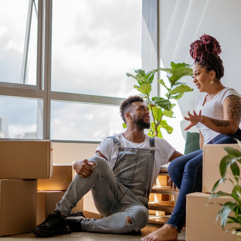 Happy young couple moving into their new home together